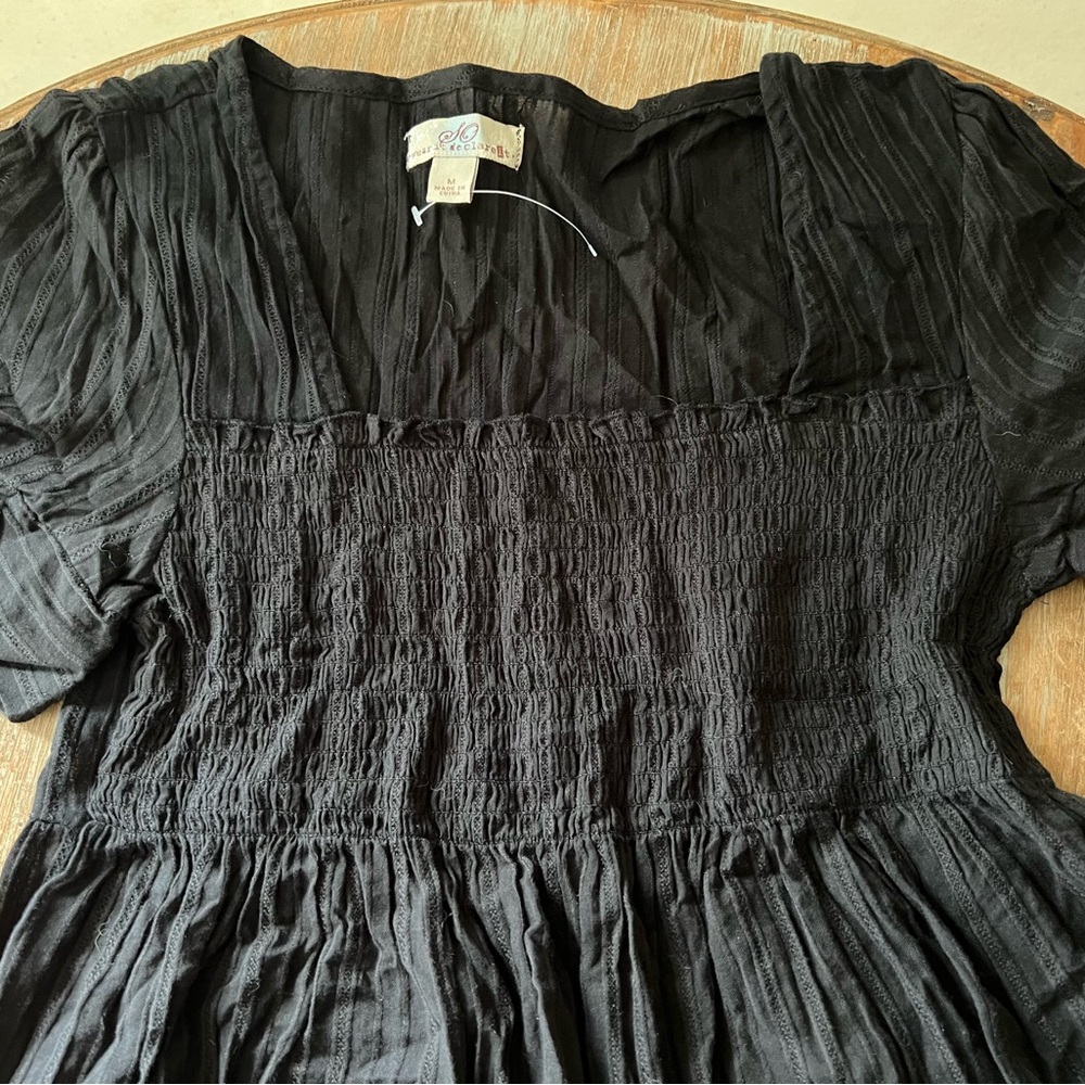 Smock top in Black. Brand new. Size Medium.

 Buy two tops together for $10/each